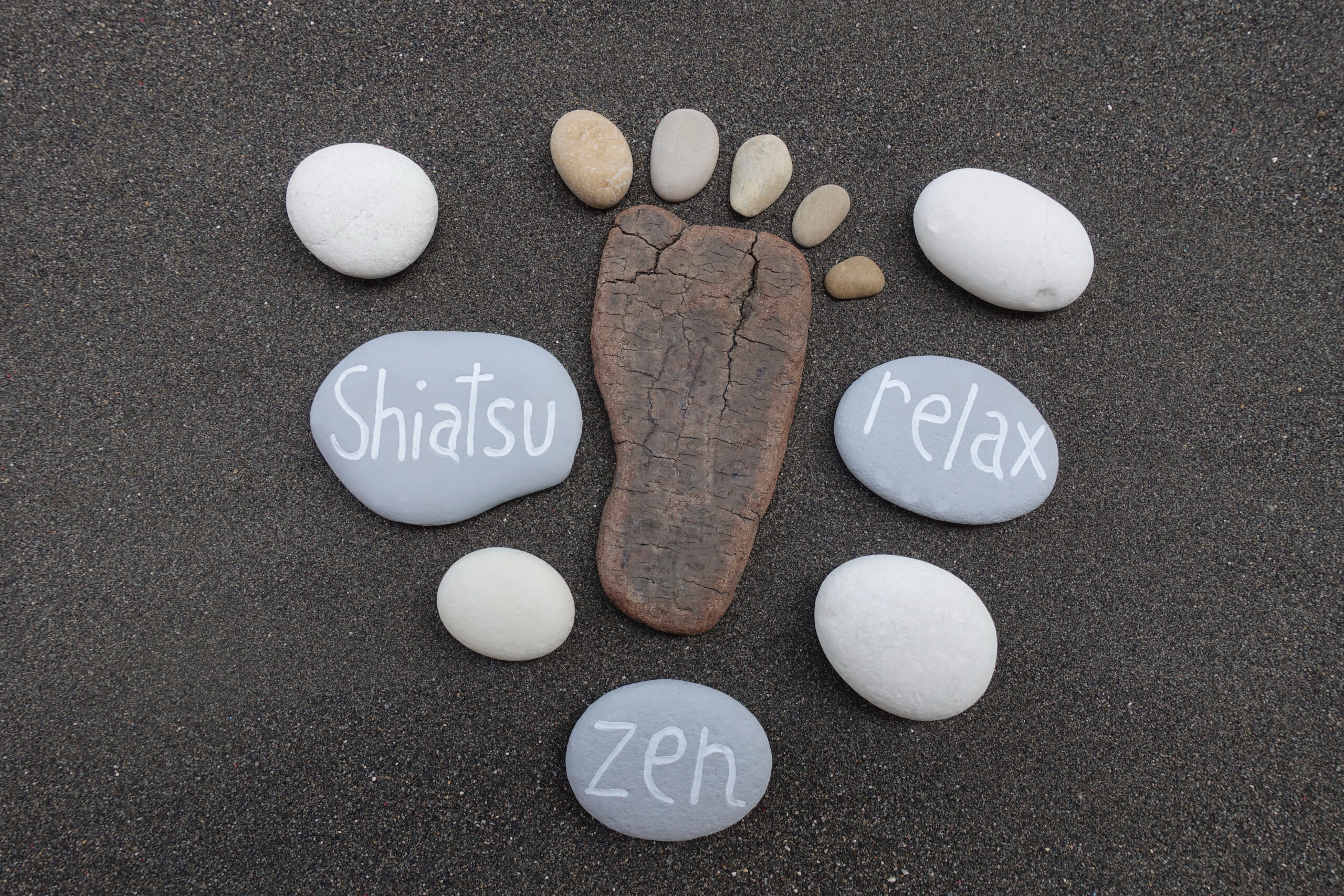 Shiatsu,,Zen,And,Relax,Concept,With,Stones,Over,Black,Volcanic